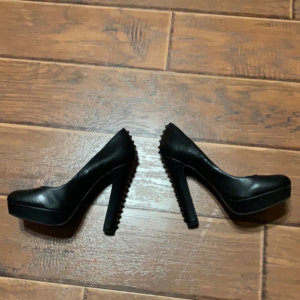 Black studded platform heals.